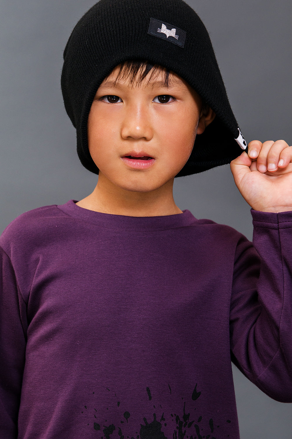 One size unisex beanie, available in Black and Punchy Plum. Made and designed in the UK.