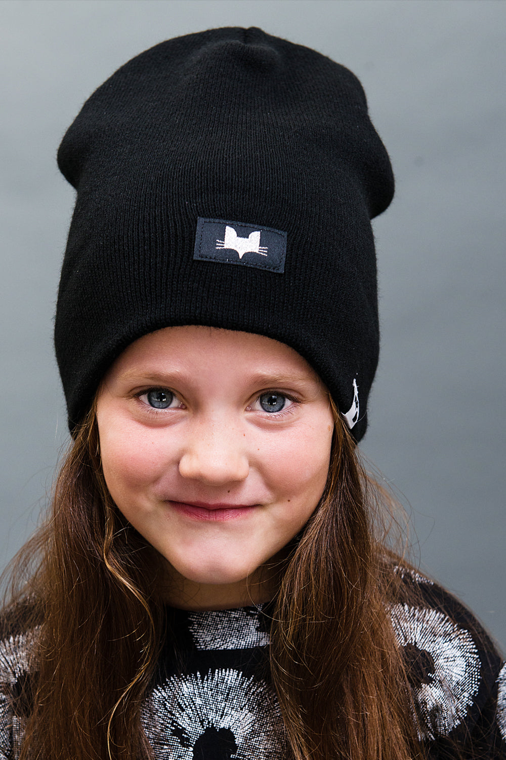 Unisex foxy beanie. Metallic silver logo badge, made and designed in the uk.