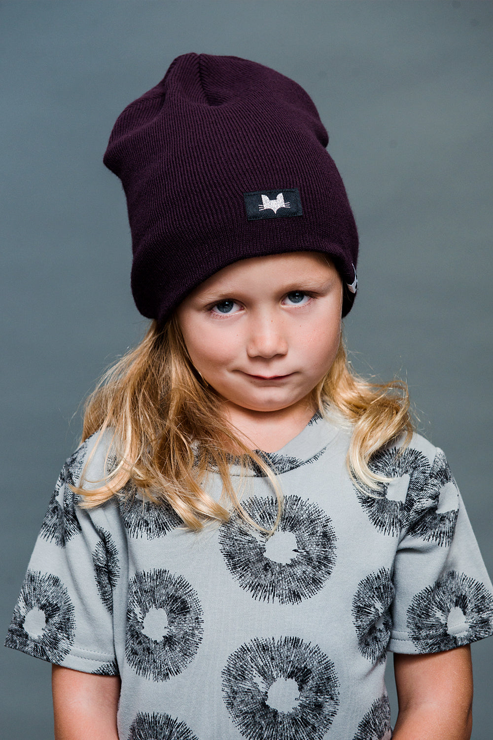 Unisex super soft beanie. Available in black and punchy plum.
